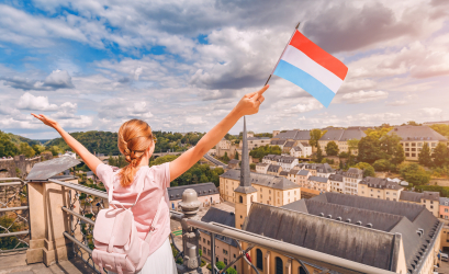 girl with a lux flag with a view of lux